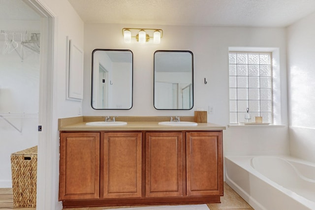 5716 Strand Loop SE, Albuquerque, NM 87106 - full bathroom featuring a garden tub, double vanity, and a walk in closet