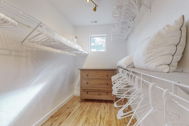 5716 Strand Loop SE, Albuquerque, NM 87106 - walk in closet with light wood finished floors