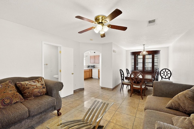 9900 Ladder Ranch Ln SW, Albuquerque, NM 87121 - living area featuring ceiling fan, arched walkways, and light tile patterned floors