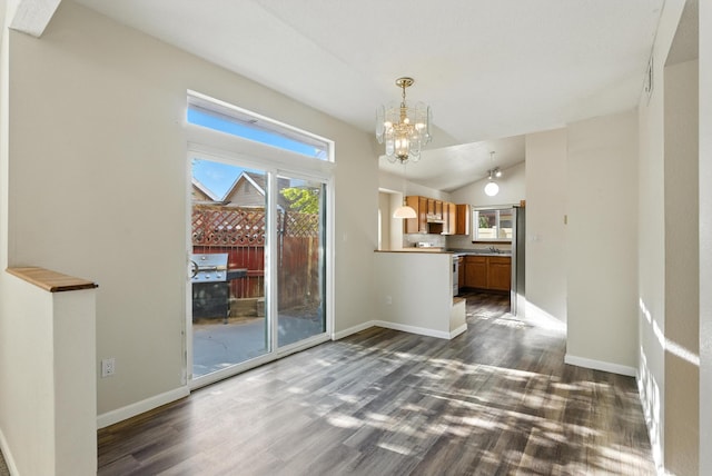 7816 Bursera Dr NW, Albuquerque, NM 87120 - unfurnished dining area with a chandelier, dark wood-style flooring, and lofted ceiling