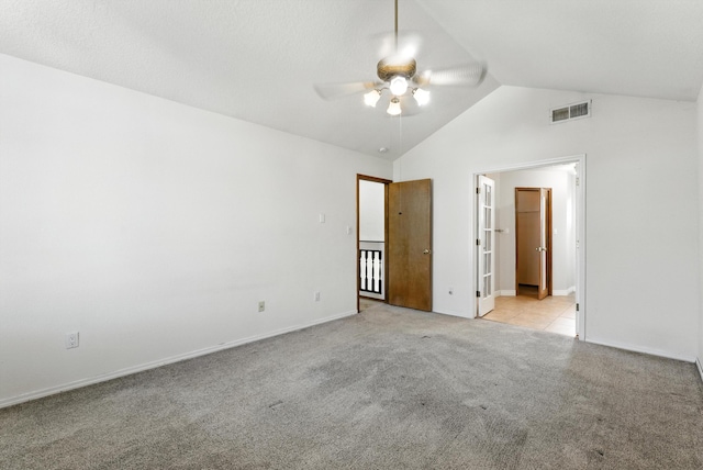 7816 Bursera Dr NW, Albuquerque, NM 87120 - unfurnished bedroom with light colored carpet, lofted ceiling, ensuite bathroom, and a ceiling fan