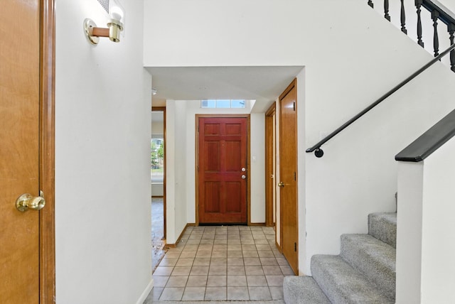 7816 Bursera Dr NW, Albuquerque, NM 87120 - foyer with stairs and light tile patterned floors