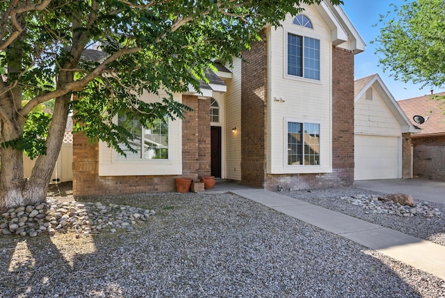 7816 Bursera Dr NW, Albuquerque, NM 87120 - view of front facade with brick siding and concrete driveway