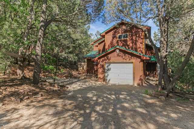 113 Sandia Crest Rd, Sandia Park, NM 87047 - view of front facade with an attached garage and dirt driveway