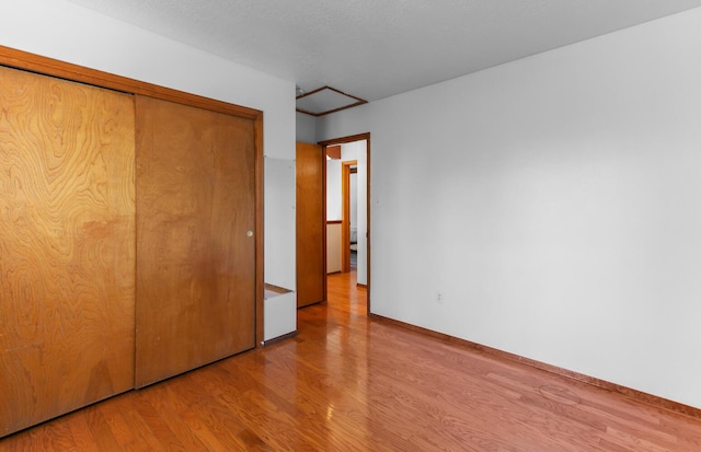 113 Sandia Crest Rd, Sandia Park, NM 87047 - unfurnished bedroom with wood finished floors and a closet