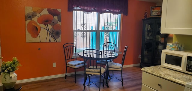 2800 Vail Ave SE Unit M 163, Albuquerque, NM 87106 - dining room featuring dark wood finished floors and baseboards