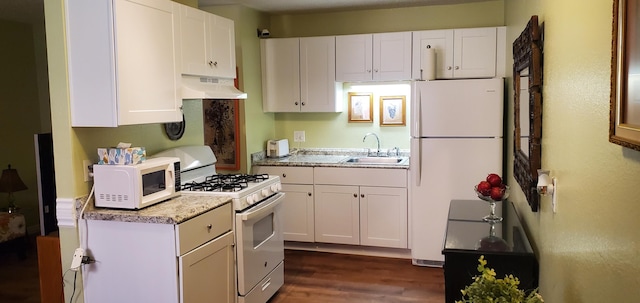 2800 Vail Ave SE Unit M 163, Albuquerque, NM 87106 - kitchen featuring white appliances, under cabinet range hood, white cabinets, dark wood-type flooring, and light stone countertops