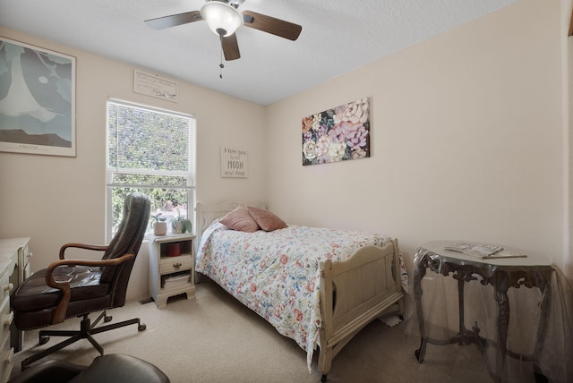 10027 Vista Cantera Ln NW, Albuquerque, NM 87114 - bedroom with carpet flooring, a ceiling fan, and a textured ceiling