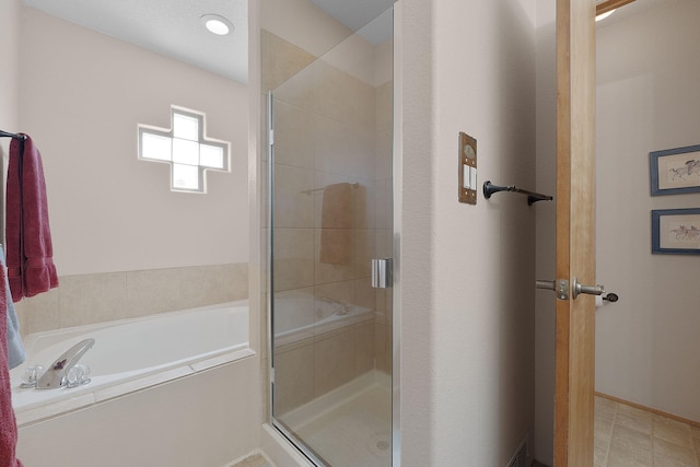 10027 Vista Cantera Ln NW, Albuquerque, NM 87114 - bathroom featuring a shower stall and a bath