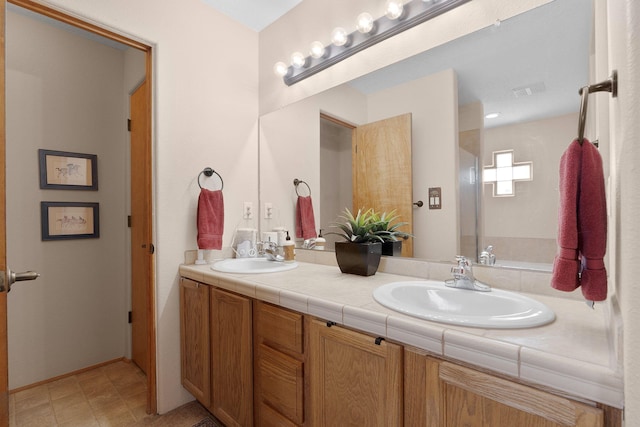 10027 Vista Cantera Ln NW, Albuquerque, NM 87114 - full bathroom with double vanity and baseboards