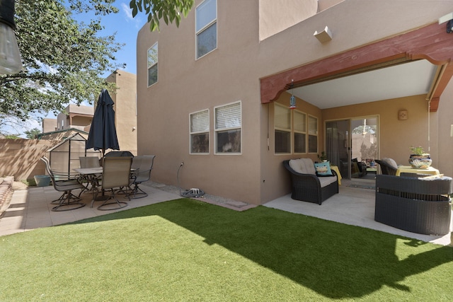 10027 Vista Cantera Ln NW, Albuquerque, NM 87114 - back of house featuring stucco siding, a patio area, and an outdoor living space