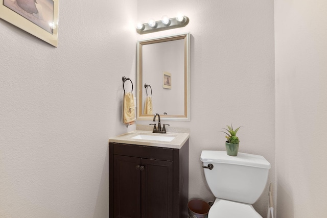 10027 Vista Cantera Ln NW, Albuquerque, NM 87114 - half bathroom featuring toilet and vanity