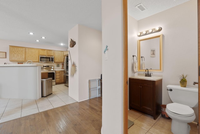 10027 Vista Cantera Ln NW, Albuquerque, NM 87114 - bathroom with vanity, recessed lighting, and wood finished floors