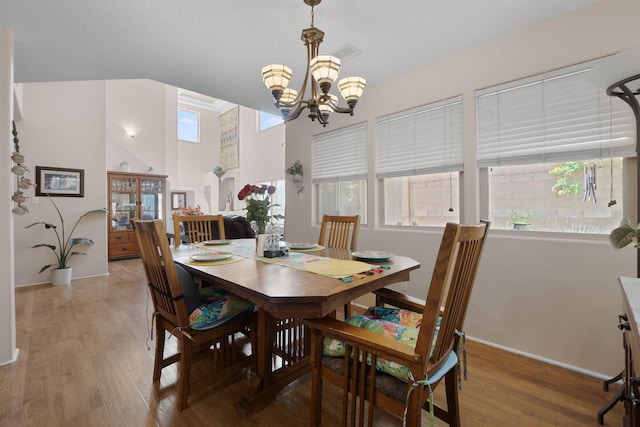 10027 Vista Cantera Ln NW, Albuquerque, NM 87114 - dining area with a chandelier and light wood-type flooring