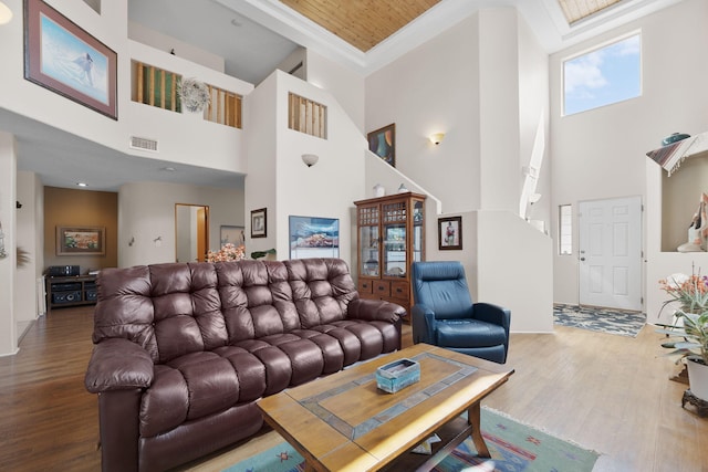 10027 Vista Cantera Ln NW, Albuquerque, NM 87114 - living area featuring a high ceiling, wood finished floors, and crown molding