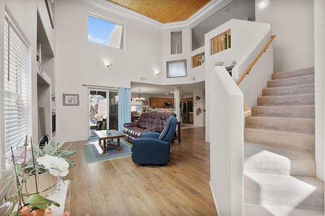 10027 Vista Cantera Ln NW, Albuquerque, NM 87114 - living room with plenty of natural light, wood finished floors, wooden ceiling, and stairway