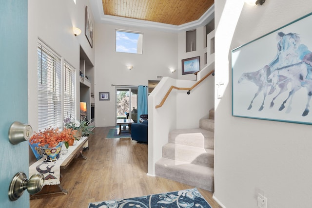 10027 Vista Cantera Ln NW, Albuquerque, NM 87114 - entryway featuring stairway, wood finished floors, wooden ceiling, and a high ceiling