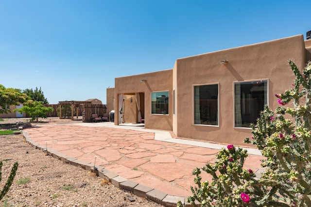 5 Ocotillo Way, Placitas, NM 87043 - back of property featuring a patio, stucco siding, and a pergola