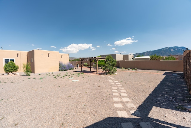 5 Ocotillo Way, Placitas, NM 87043 - view of yard with a pergola and a mountain view