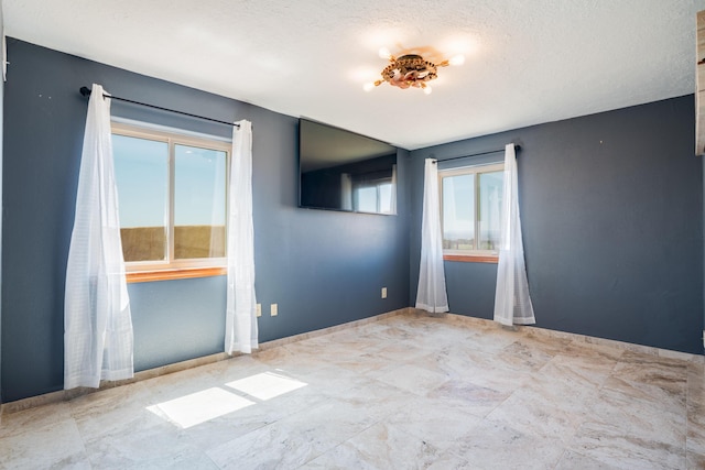 5 Ocotillo Way, Placitas, NM 87043 - empty room featuring a textured ceiling