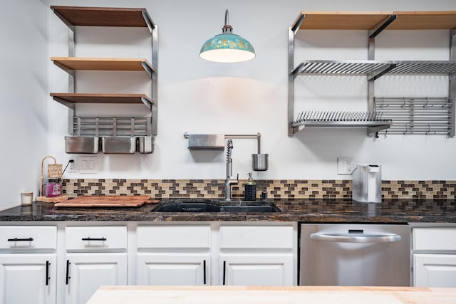 5 Ocotillo Way, Placitas, NM 87043 - kitchen with open shelves, stainless steel dishwasher, decorative backsplash, white cabinetry, and dark stone countertops