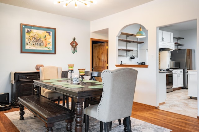5 Ocotillo Way, Placitas, NM 87043 - dining area with light wood finished floors and a chandelier