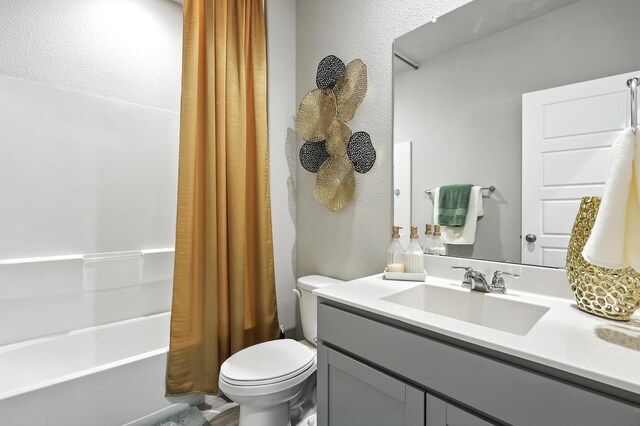 583 Turmalina Dr SE, Rio Rancho, NM 87124 - bathroom featuring vanity, a textured wall, and shower / bath combo with shower curtain