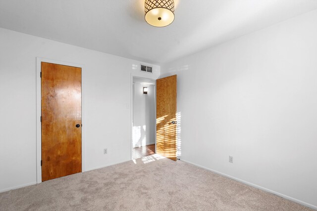 504 Ortiz Dr NE, Albuquerque, NM 87108 - unfurnished bedroom featuring carpet flooring and baseboards