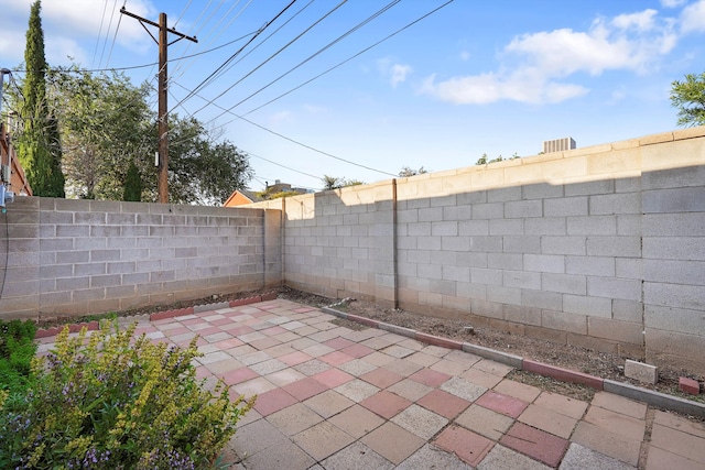 504 Ortiz Dr NE, Albuquerque, NM 87108 - fenced backyard with a patio