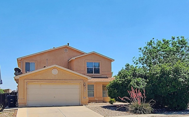 3920 Rancho Centro NW, Albuquerque, NM 87120 - view of front of home with concrete driveway, stucco siding, and a garage