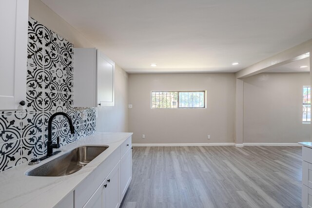 245 Chama St NE, Albuquerque, NM 87108 - kitchen featuring light wood-style floors, white cabinetry, light stone counters, and recessed lighting