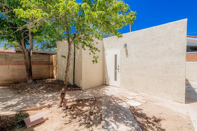 245 Chama St NE, Albuquerque, NM 87108 - rear view of property with stucco siding and a patio