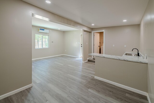 245 Chama St NE, Albuquerque, NM 87108 - spare room featuring light wood-style flooring, recessed lighting, and a wall unit AC