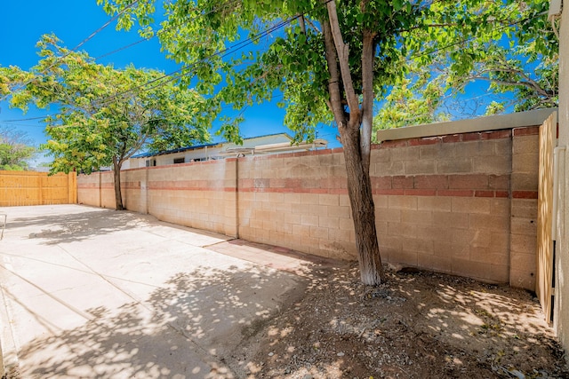 245 Chama St NE, Albuquerque, NM 87108 - fenced backyard featuring a patio area
