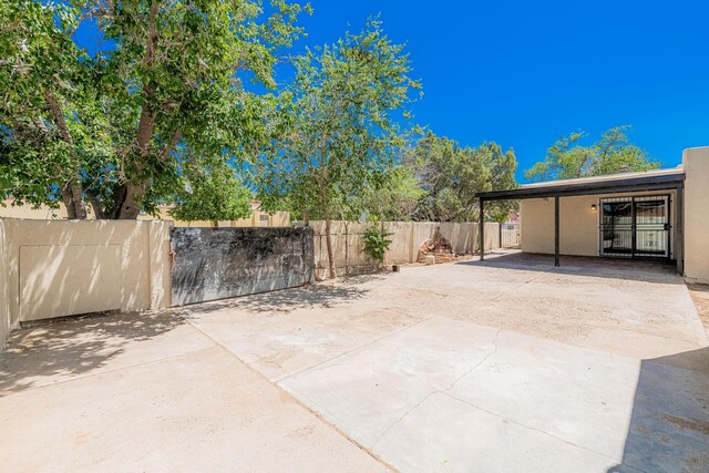 245 Chama St NE, Albuquerque, NM 87108 - view of patio with a carport