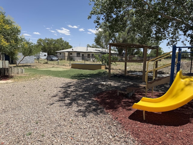 4 Los Chavez Park Rd, Belen, NM 87002 - view of yard with a playground