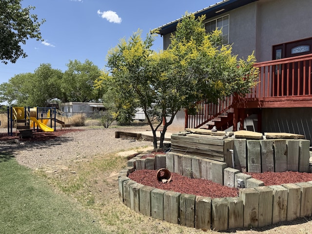 4 Los Chavez Park Rd, Belen, NM 87002 - view of yard featuring a playground and stairs