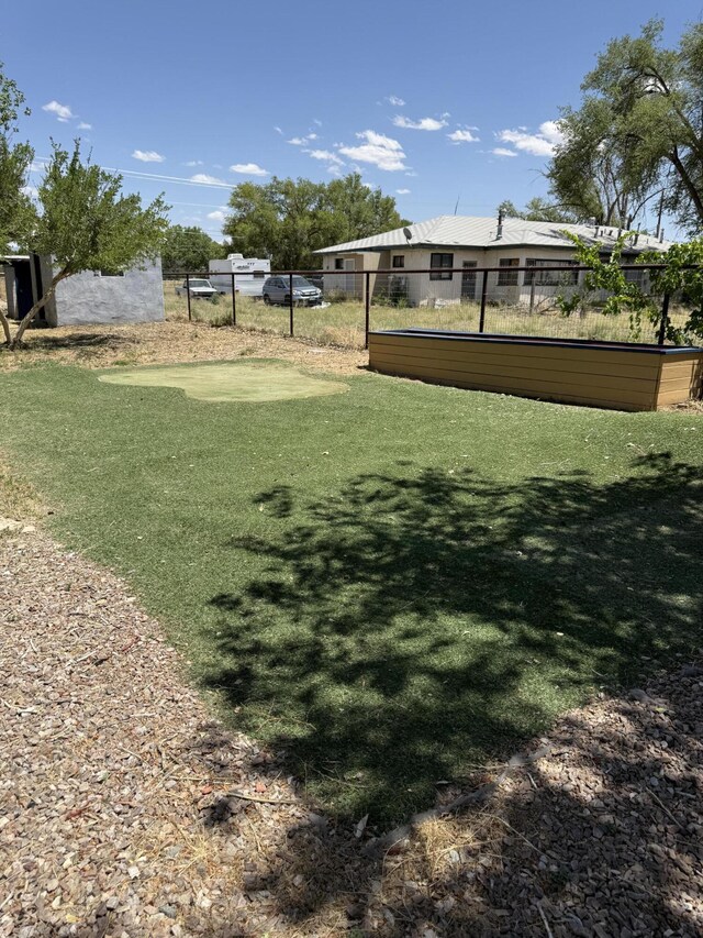 4 Los Chavez Park Rd, Belen, NM 87002 - view of yard featuring a putting area