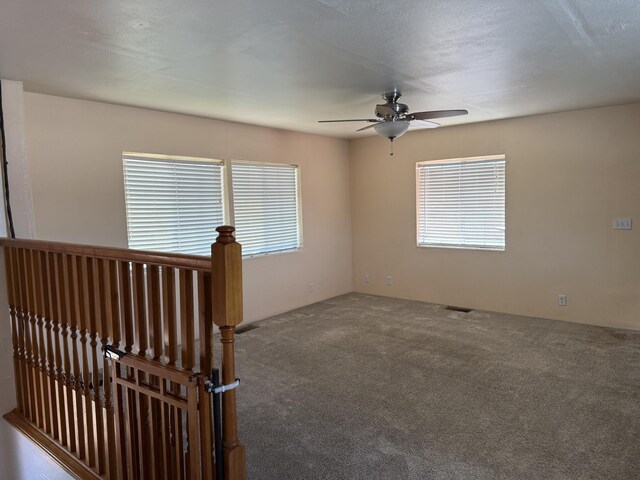 4 Los Chavez Park Rd, Belen, NM 87002 - carpeted empty room with a ceiling fan and healthy amount of natural light