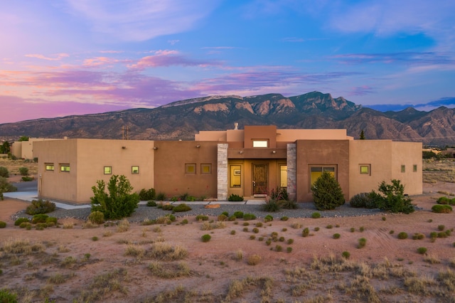 24 Norte Trl, Placitas, NM 87043 - pueblo-style house with a mountain view and stucco siding