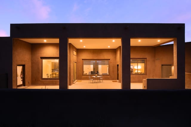 24 Norte Trl, Placitas, NM 87043 - back of house featuring a patio area and stucco siding