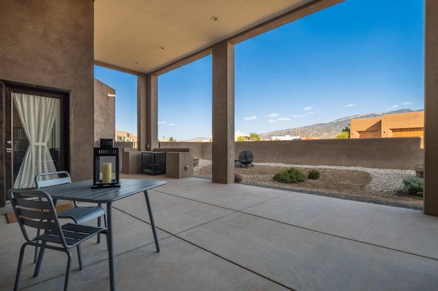 24 Norte Trl, Placitas, NM 87043 - fenced backyard featuring a patio and a mountain view