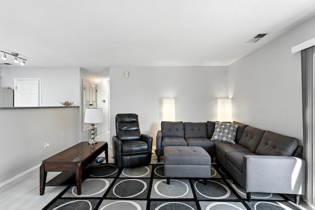 4801 Irving Blvd NW Unit 304, Albuquerque, NM 87114 - living room featuring wood finished floors and rail lighting