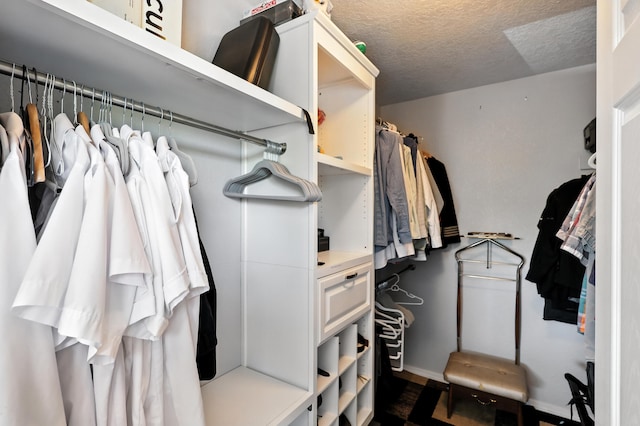 4801 Irving Blvd NW Unit 304, Albuquerque, NM 87114 - walk in closet featuring dark wood-style flooring
