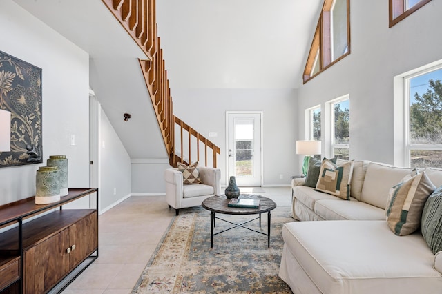 19 Bobcat Hill Rd, Sandia Park, NM 87047 - living area with stairs, a high ceiling, and light tile patterned floors