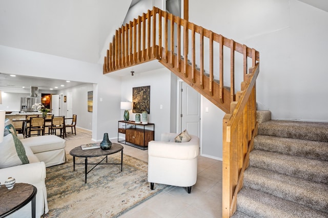 19 Bobcat Hill Rd, Sandia Park, NM 87047 - tiled living room with a towering ceiling and stairway