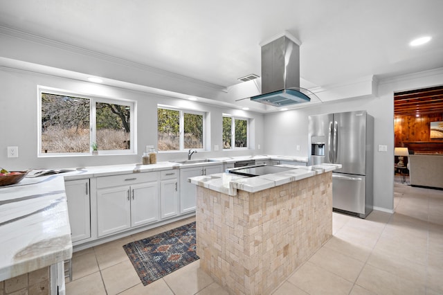19 Bobcat Hill Rd, Sandia Park, NM 87047 - kitchen with stainless steel fridge with ice dispenser, island range hood, ornamental molding, light tile patterned floors, and a center island