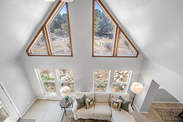 19 Bobcat Hill Rd, Sandia Park, NM 87047 - sitting room with tile patterned flooring and high vaulted ceiling