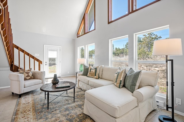 19 Bobcat Hill Rd, Sandia Park, NM 87047 - living room featuring a towering ceiling, stairway, tile patterned flooring, and baseboard heating