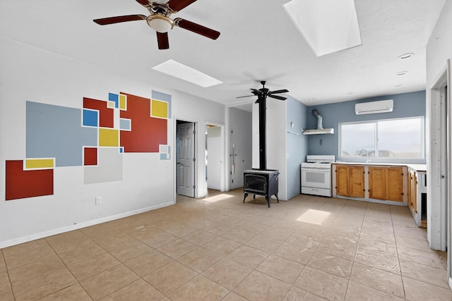 228 18th St SW, Rio Rancho, NM 87124 - unfurnished living room with a skylight, a wall mounted AC, a ceiling fan, and a wood stove